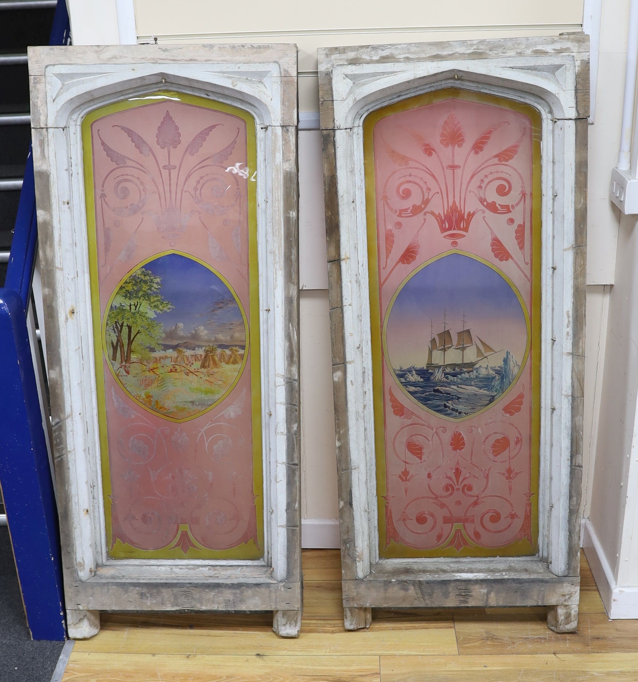 A pair of early 20th century Gothic style painted glass windows depicting an ice breaker and a corn field, W 62cm, D 17cm, H 151 cm